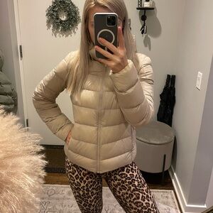 Uniqlo ultra light beige down jacket with the hood. Size XS